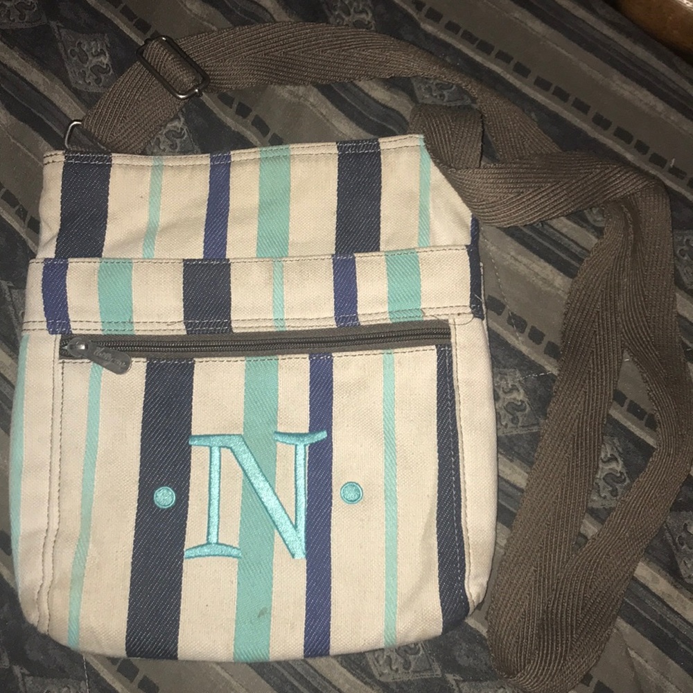 Purse with letter “N” on it.